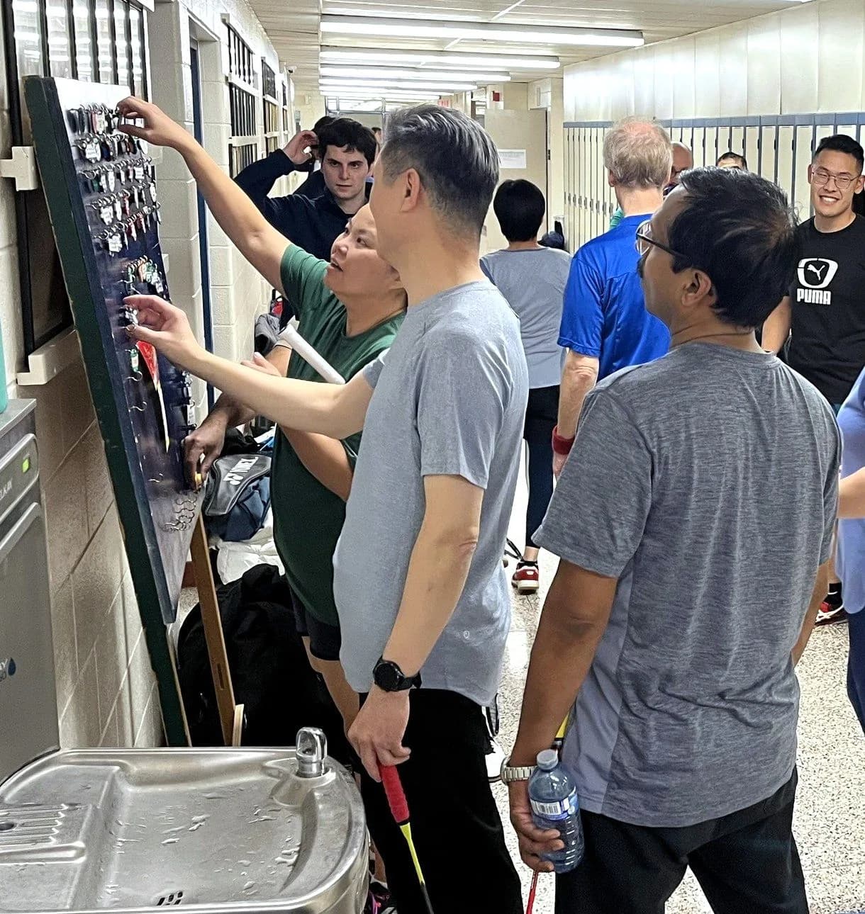 Members choosing their tags at the board